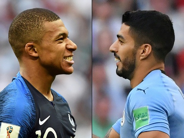Duell der Stürmerstars: Frankreichs Mbappe (l.) gegen Uruguays Suarez.